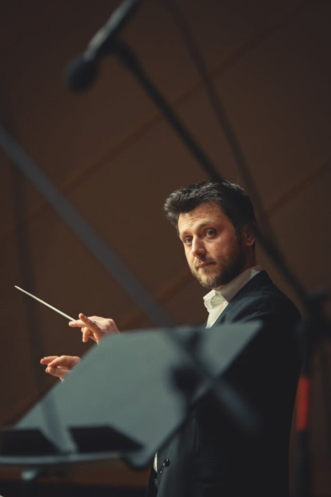 A Conductor Holding a Baton