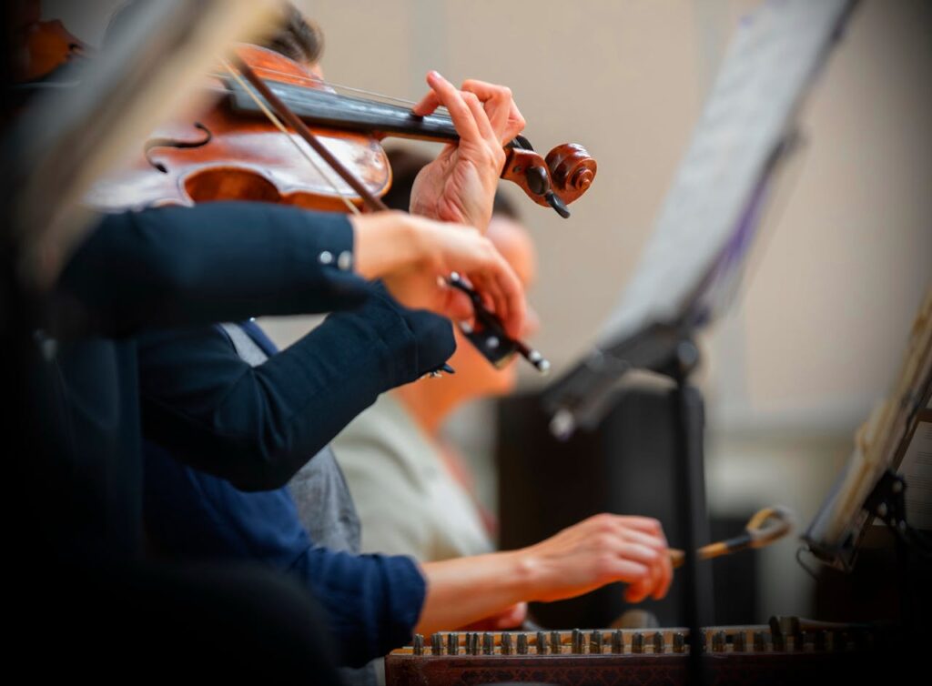 Close-up of People Playing in an Orchestra 